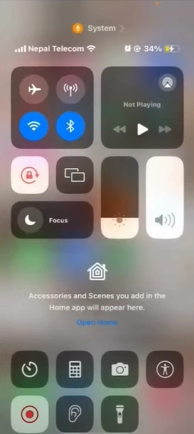 Swipe up from the bottom to close the Control Center